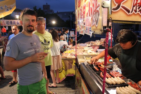 Jer getting some seriously awesome sweet Taiwanese sausage at a night market in Taichung, July 2013.  
